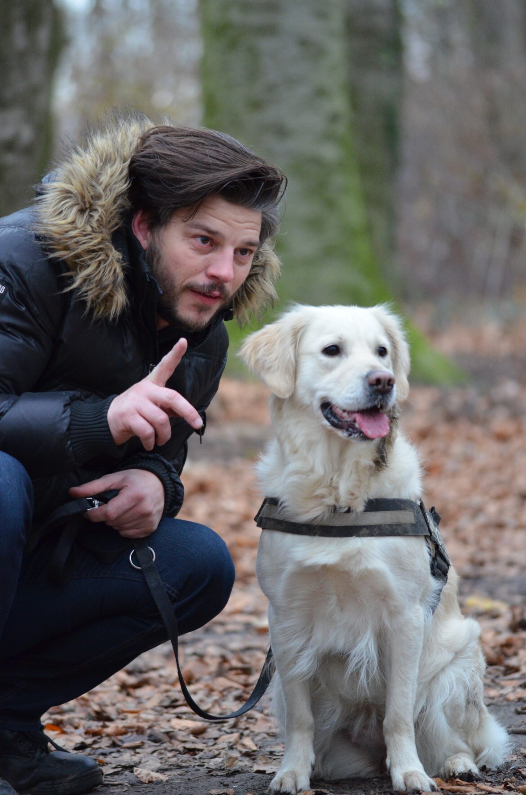 a dog training expert talking to his dog